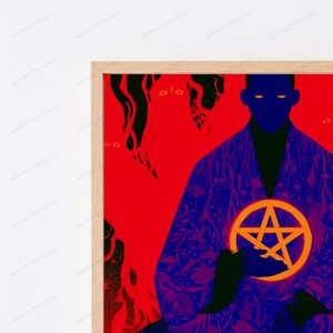 May include: A framed art print featuring a dark blue silhouette of a figure holding a glowing orange pentagram. The background is a vibrant red with black organic shapes and patterns. The figure has glowing orange eyes and wears a patterned robe.