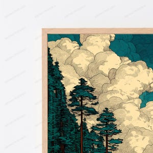 May include: A framed wall art print featuring a stylized landscape with dark teal evergreen trees in the foreground and large, voluminous cream-colored clouds against a deep teal sky, all enclosed in a light-toned wooden frame.