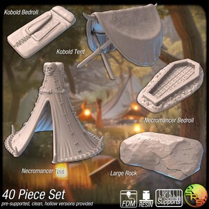 May include: A collection of miniature fantasy camping and sleeping accessories, including a bedroll, tent, and rock. The set includes a Kobold bedroll and tent, a Necromancer bedroll and tent, and a large rock. The text "40 Piece Set" is visible.