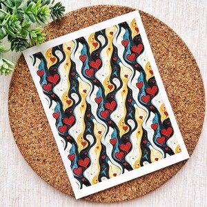 May include: A print featuring a repeating pattern of red hearts on a black, white and blue background. The hearts are stylised and appear to be floating in a swirling pattern.