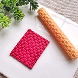 May include: A red silicone rolling pin with a heart pattern and a matching silicone sheet with a heart pattern.