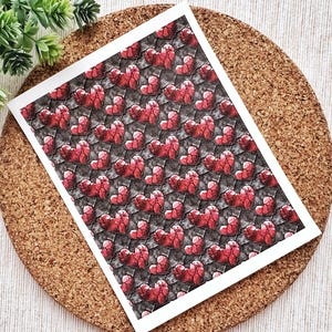May include: A seamless pattern featuring a repeating design of red hearts with a black and grey textured background.