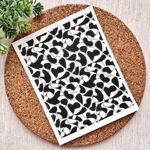 May include: Black and white abstract art print featuring a repeating pattern of organic shapes. The print is on a white background and has a modern minimalist style.