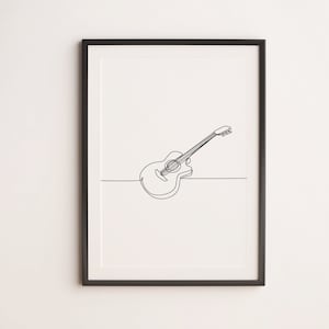 May include: A black framed print of a line drawing of an acoustic guitar on a white background.