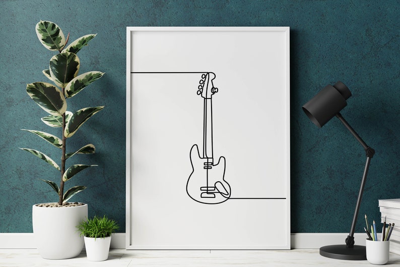 May include: A white framed print with a black line drawing of an electric guitar on a white background.