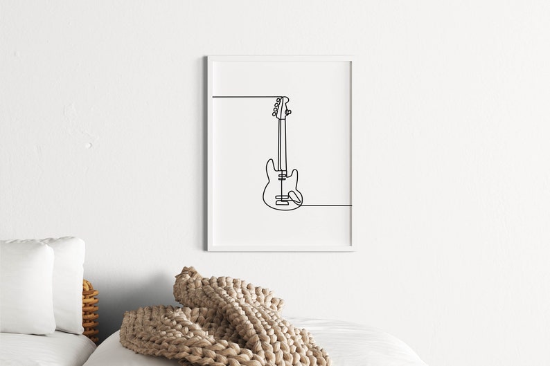 May include: A black and white line drawing of a bass guitar in a white frame.