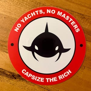 May include: A round sticker with a red border and white center. The center features a black orca design. The text "NO YACHTS, NO MASTERS" arcs around the top, and "CAPSIZE THE RICH" is at the bottom.