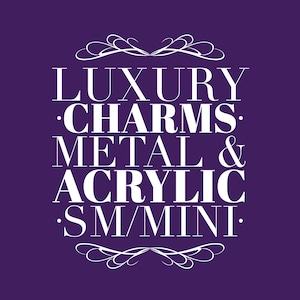 May include: White text on a purple background reads "LUXURY CHARMS: METAL & ACRYLIC SM/MINI."
