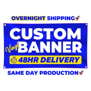 May include: A blue vinyl banner with white text that reads "CUSTOM BANNER" and "48HR DELIVERY". The banner also has the text "OVERNIGHT SHIPPING" and "SAME DAY PRODUCTION" in yellow and white.