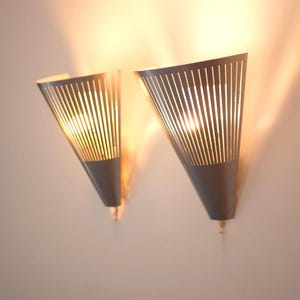 Wall sconces, a pair of Mid-century modern vintage Scandinavian Ikea wall lights. A pair of vintage Klyka wall lamps with US plug option