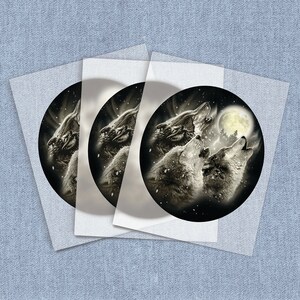 May include: Three wolves howling at the moon in a snowy forest. The wolves are silhouetted against a full moon and a dark sky. The image is in black and white.
