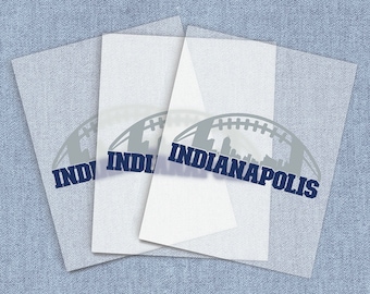 May include: Three sheets of clear vinyl with a grey silhouette of a football with a cityscape inside and the text "INDIANAPOLIS" in blue.