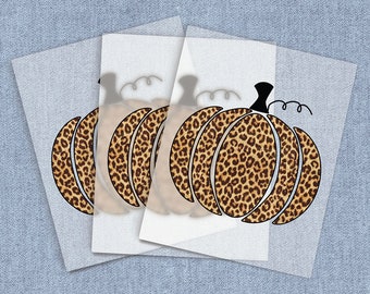 May include: Three sheets of clear vinyl with a leopard print pumpkin design. The pumpkin is outlined in black and has a small stem.