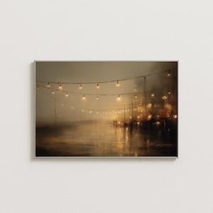 May include: Framed art print depicting a nighttime scene with string lights illuminating a wet street. The artwork features a warm color palette of golds and browns, with blurred figures in the distance, creating a moody atmosphere.