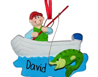 May include: A personalized Christmas ornament featuring a cartoon man in a blue shirt and green vest fishing from a white boat. The boat is in blue water with a green fish jumping out of the water. The ornament is personalized with the name "David".