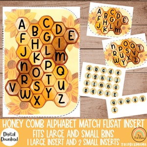 May include: Honeycomb alphabet match flisat insert for preschoolers. The set includes a large honeycomb board with letters A-Z, a small honeycomb board with letters A-Z, and 26 individual letter circles. The honeycomb boards are yellow and brown with a watercolor sunflower design. The letter circles are yellow with black letters.