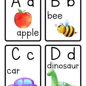 May include: Four alphabet flashcards with watercolor illustrations. The first card shows the letter A with a red apple. The second card shows the letter B with a yellow and black bee. The third card shows the letter C with a purple car. The fourth card shows the letter D with a green dinosaur.