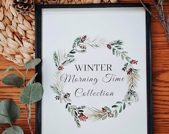 May include: A framed print featuring a watercolour wreath of pine branches, pine cones, and berries. The wreath encircles the text "WINTER Morning Time Collection".
