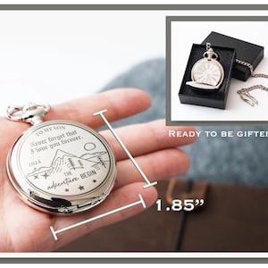 a hand holding a silver pocket watch with a message engraved on it, and there is a separate image of the same pocket watch in a box.