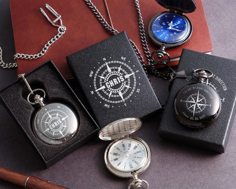 a collection of three pocket watches, each with a unique design and color, displayed on a dark surface.
