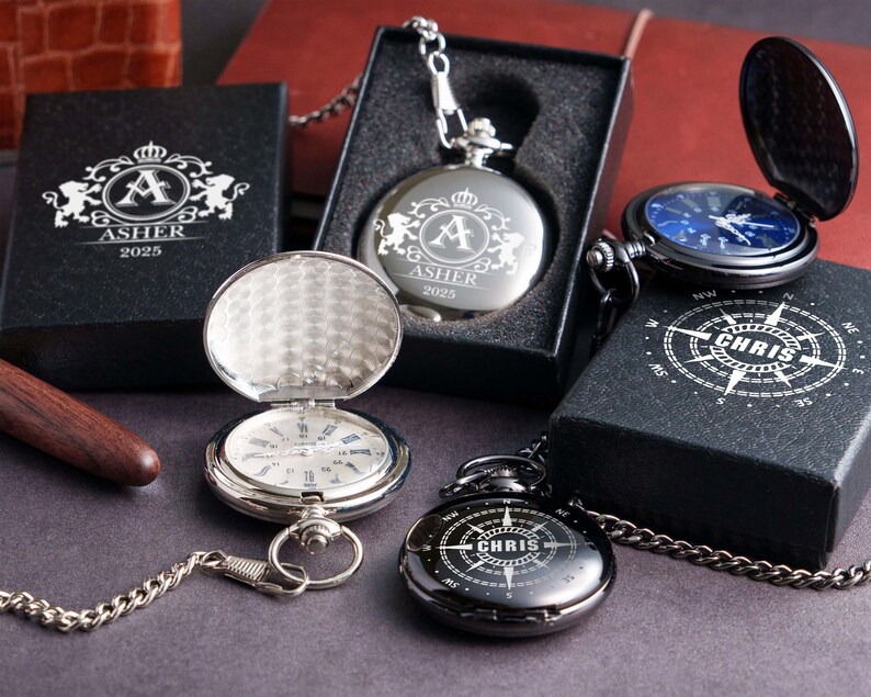 A collection of pocket watches and boxes with personalized engravings, including the name "Ashler" and the year "2025".