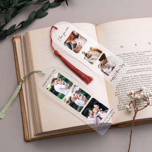 a pair of clear photo-editing bookmarks with printed family photos, placed on top of an open book.