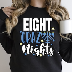 May include: Black sweatshirt with the text "EIGHT CRAZY NIGHTS" in white with a blue menorah and yellow stars.