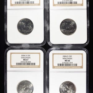 May include: Four 2004 Wisconsin quarter coins, each in a clear plastic holder with a white label. The labels show the coin's grade and serial number from the Numismatic Guaranty Corporation.