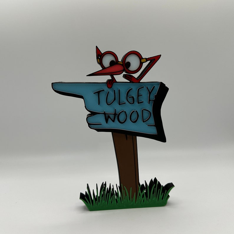 May include: A red bird with glasses points to a blue sign that says "Tulgey Wood". The sign is on a brown wooden post and is surrounded by green grass.