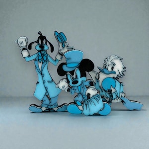 Three 3D‑printed figurines styled after Goofy, Mickey Mouse, and Donald Duck, each dressed in formal monochromatic blue outfits. Goofy stands on the left in a long coat holding a hat; Mickey is centered in a blue suit with a top hat and a small bag; Donald stands on the right in a blue coat with a bow tie. All three have smooth, stylized surfaces and a cohesive blue color theme, arranged against a plain light background.