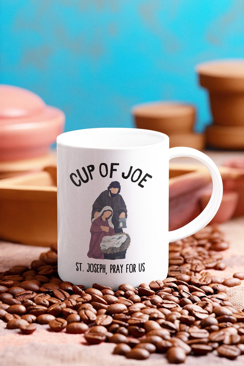 This traditional Catholic coffee mug honors St. Joseph. It reads whimsically, "Cup of Joe."