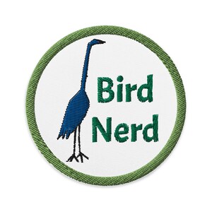 May include: Green and white embroidered patch with a blue bird and the text "Bird Nerd".