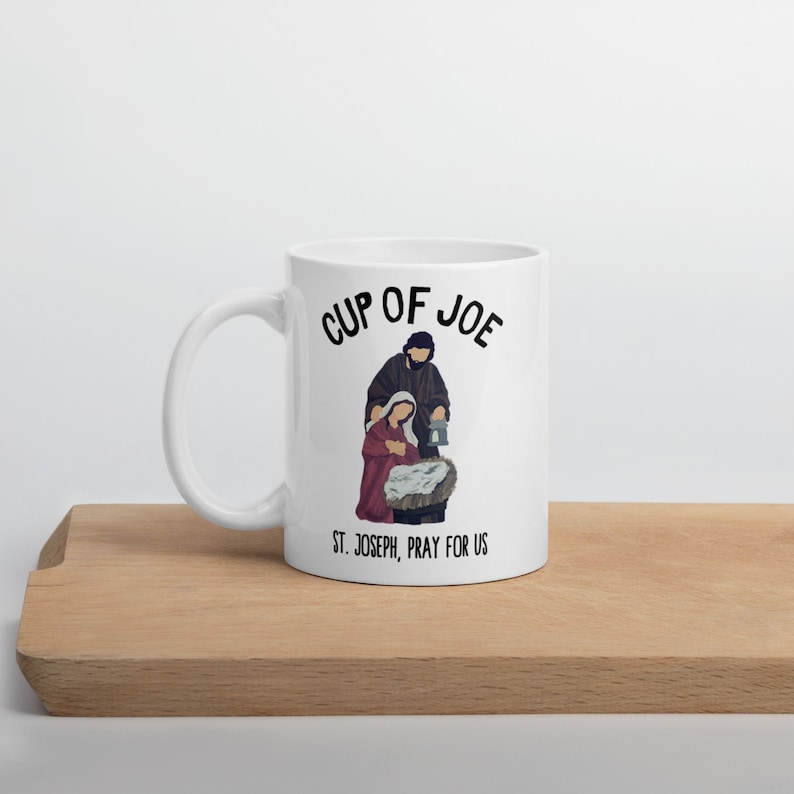 At the bottom of the cup, the caption reads, "St. Joseph, pray for us." A beautiful Catholic gift!