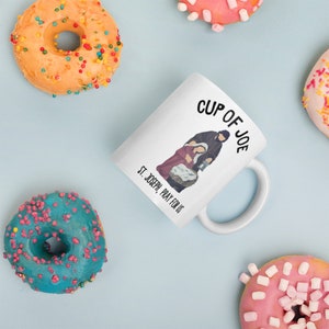 This traditional Catholic coffee mug honors St. Joseph. It reads whimsically, "Cup of Joe."