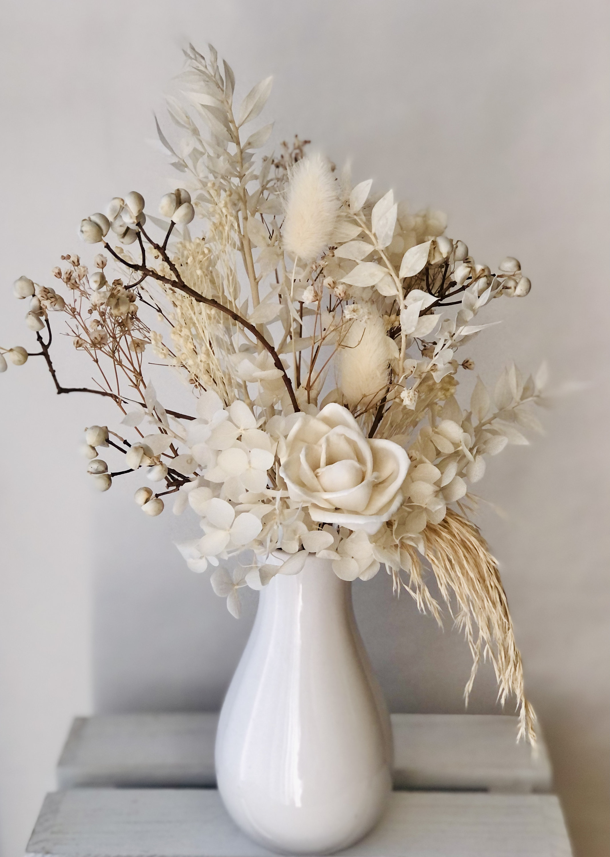 Beautiful Dried Hydrangeas In Big Transparent Glass Vase On Pink