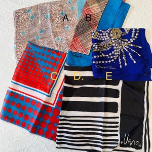 May include: Five square silk scarves labeled A through E. A features a beige dotted pattern with blue circles. B has a red and black grid on a blue background. C displays red and blue polka dots. D shows black and white stripes. E depicts a pearl necklace.