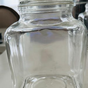 May include: A set of three ceramic mugs with a speckled, matte finish. The mugs are in shades of cream, light gray, and dark gray. Each mug has a simple, minimalist design, perfect for coffee or tea.