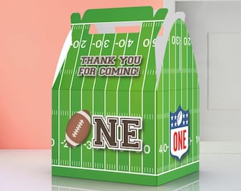 May include: Green and white favor box with a football field design. The box has a handle and says "Thank you for coming!" and "One" with a football graphic.