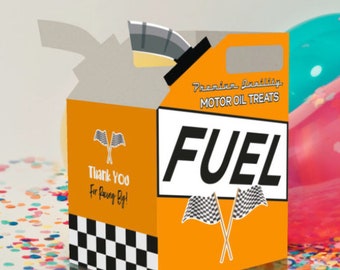 May include: Orange and black party favor box shaped like a gas can with the word "FUEL" in white letters. The box has a checkered pattern and says "Premium Quality Motor Oil Treats" and "Thank You For Racing By!"
