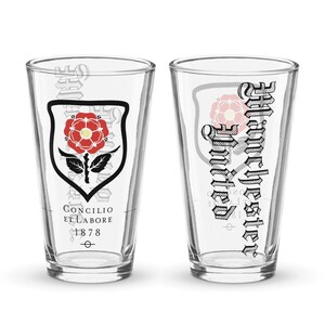 May include: Two clear glass pint glasses with a red rose and shield design on one and the text "Concilio et Labore 1878" and the text "Grangechester" on the other.