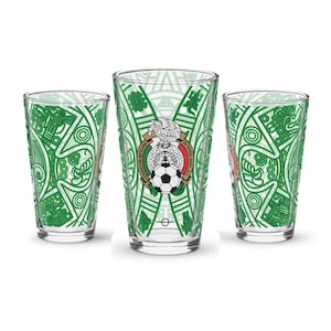 May include: Three clear glass pint glasses with a green and white design. The glasses feature the Mexican national emblem with a soccer ball and the words "Federación Mexicana de Fútbol Asociación, A.C."