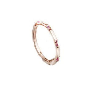 May include: A delicate rose gold band ring with small pink gemstones set into the band.