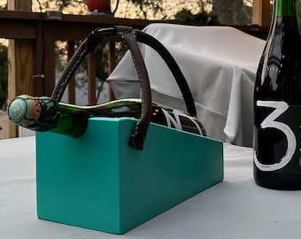 Wooden beer, sour beer, lambic cradle with leather handle. Using features of wood and leather to create this one of a kind bottle holder.