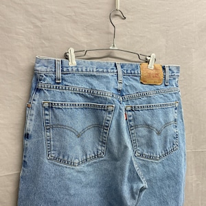 36 x 30 / 1990s Levi&#39;s 560 Baggy Light Wash Distressed Denim Jeans
