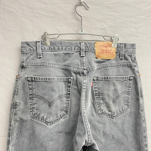 34 x 36 / Vintage Levi&#39;s 560 Faded Black/Grey Distressed Loose Fit Tapered Leg Jeans