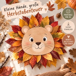 May include: A craft project featuring a central illustration of a light brown lion face with whiskers and pink cheeks, surrounded by a circular arrangement of colourful autumn leaves in shades of red, orange, and yellow, with German text.