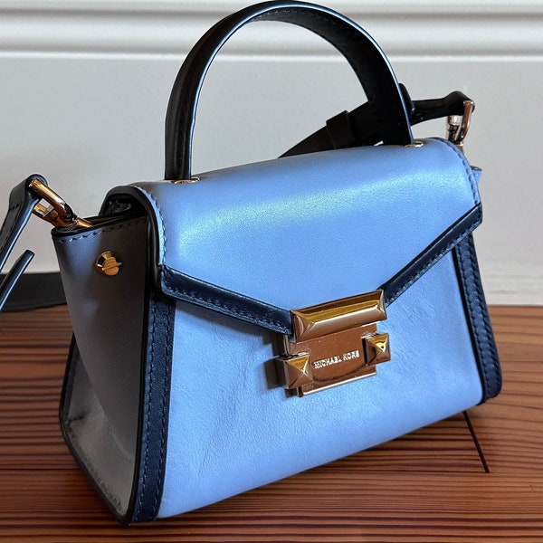 Michael Kors Leather Whitney Top Handle Mini Bag in Sky Blue with Navy • Removable Crossbody Strap • Gold Hardware • Studded Lock Clasp •