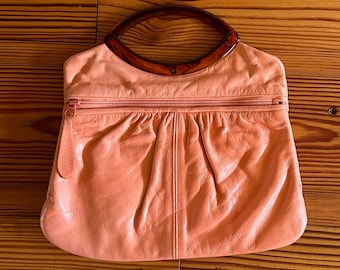 Vintage 1980’s ‘Justin Western’ Small Leather Clutch Handbag in Pink Coral • Brown Lucite Handle • Matching Zipper & Pull • Soft Cowhide