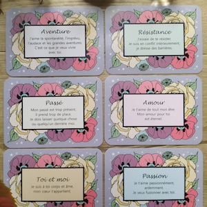 May include: A set of 6 cards with floral illustrations and text in French. The cards feature the words "Aventure", "R&eacute;sistance", "Pass&eacute;", "Amour", "Toi et moi", and "Passion".