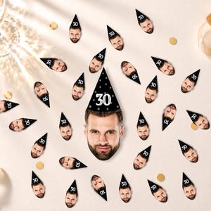 May include: A collection of custom party confetti featuring a man's face wearing a black party hat with white stars and the number 30 printed on it. The confetti pieces are scattered, with one large central piece and many smaller versions.